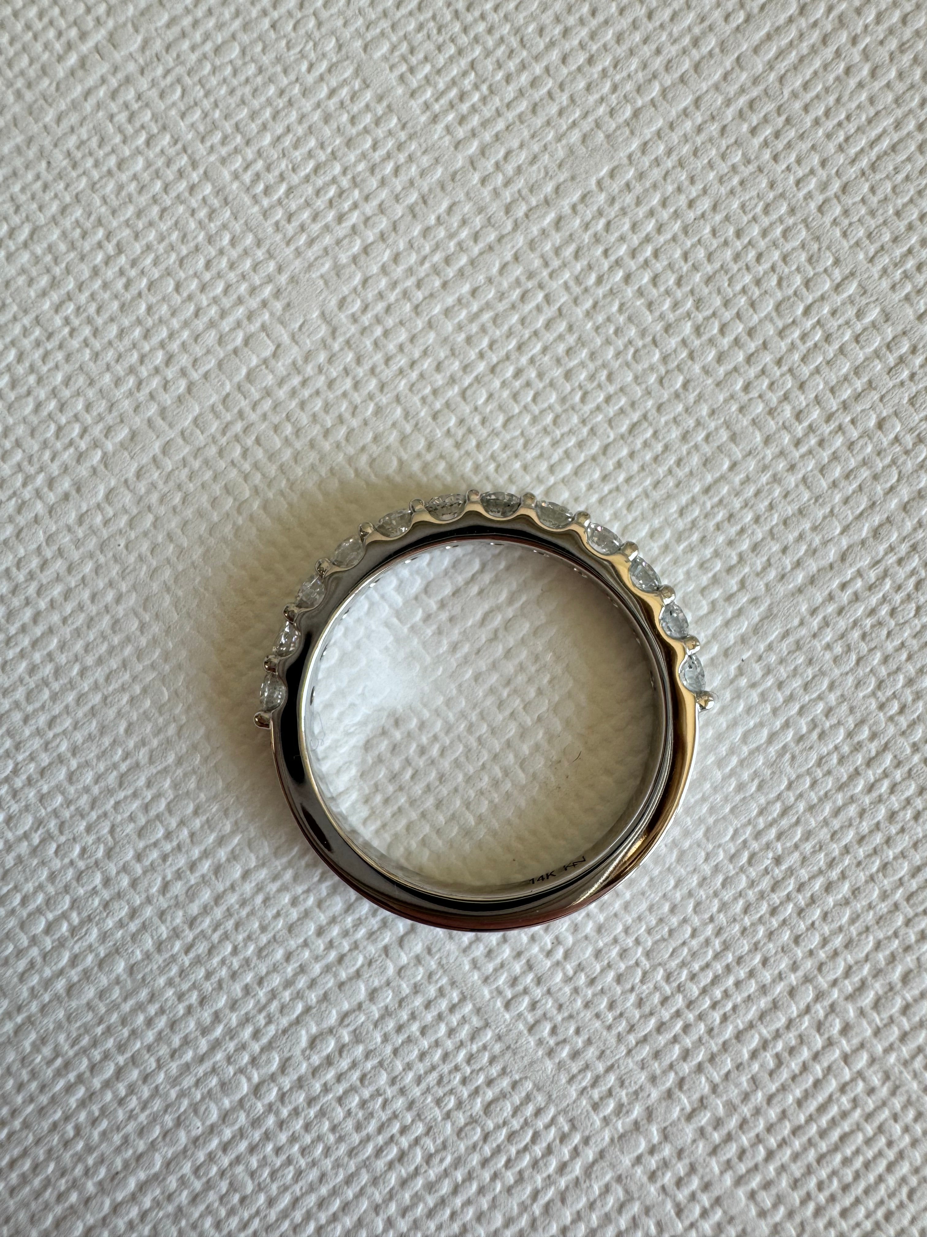 Custom, 14k white gold lab grown diamond band containing 12, round lab grown diamonds totaling approximately .78 carats. Size 7.5.