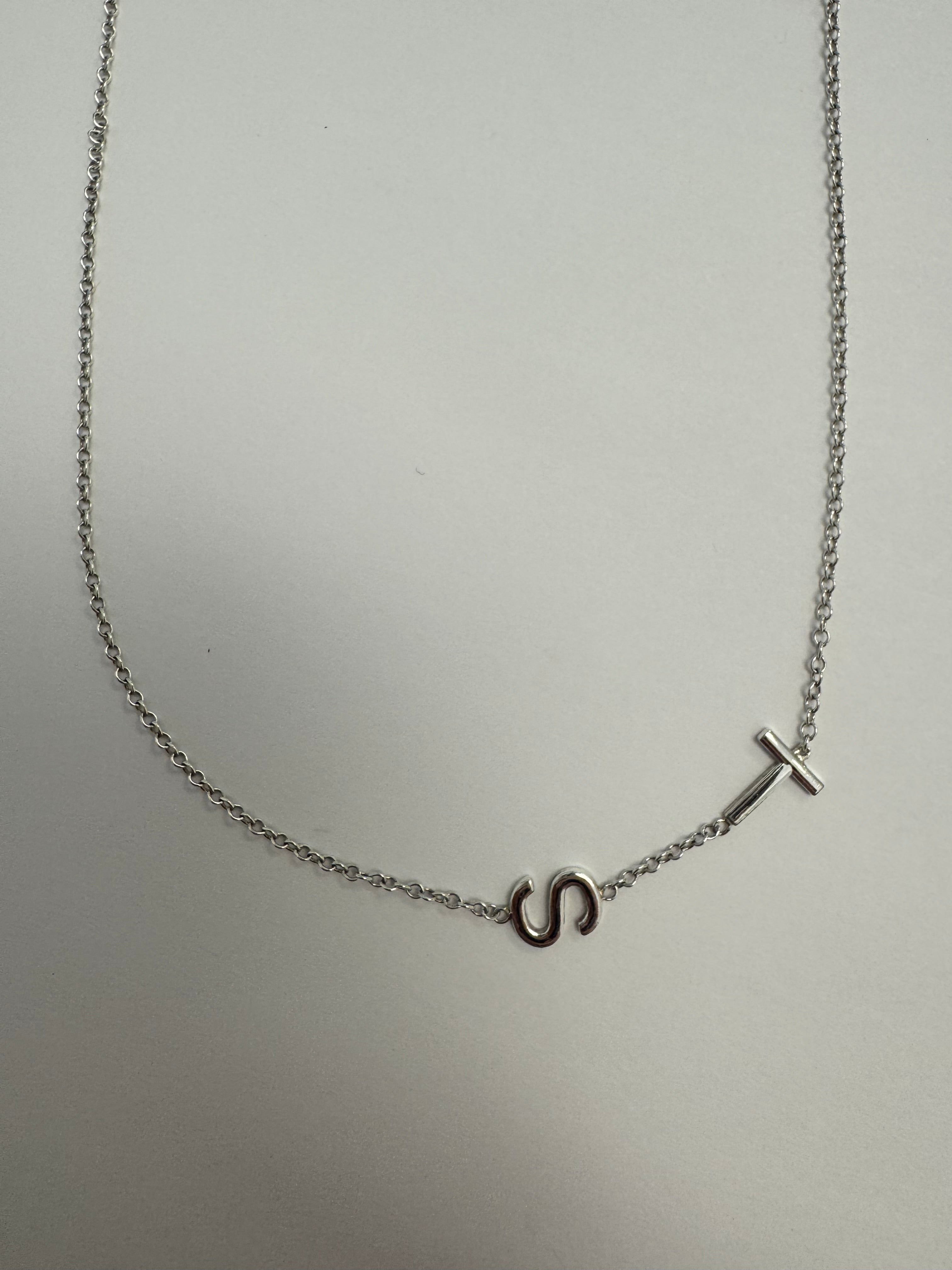 Sterling silver "TS" necklace- weld chain back to initial and check others. No charge.