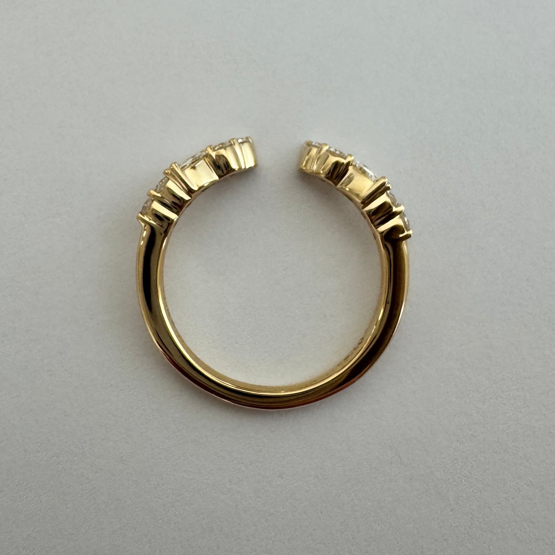 14k yellow gold lab grown diamond open style wedding band. 0.27 cttw. Size 4.