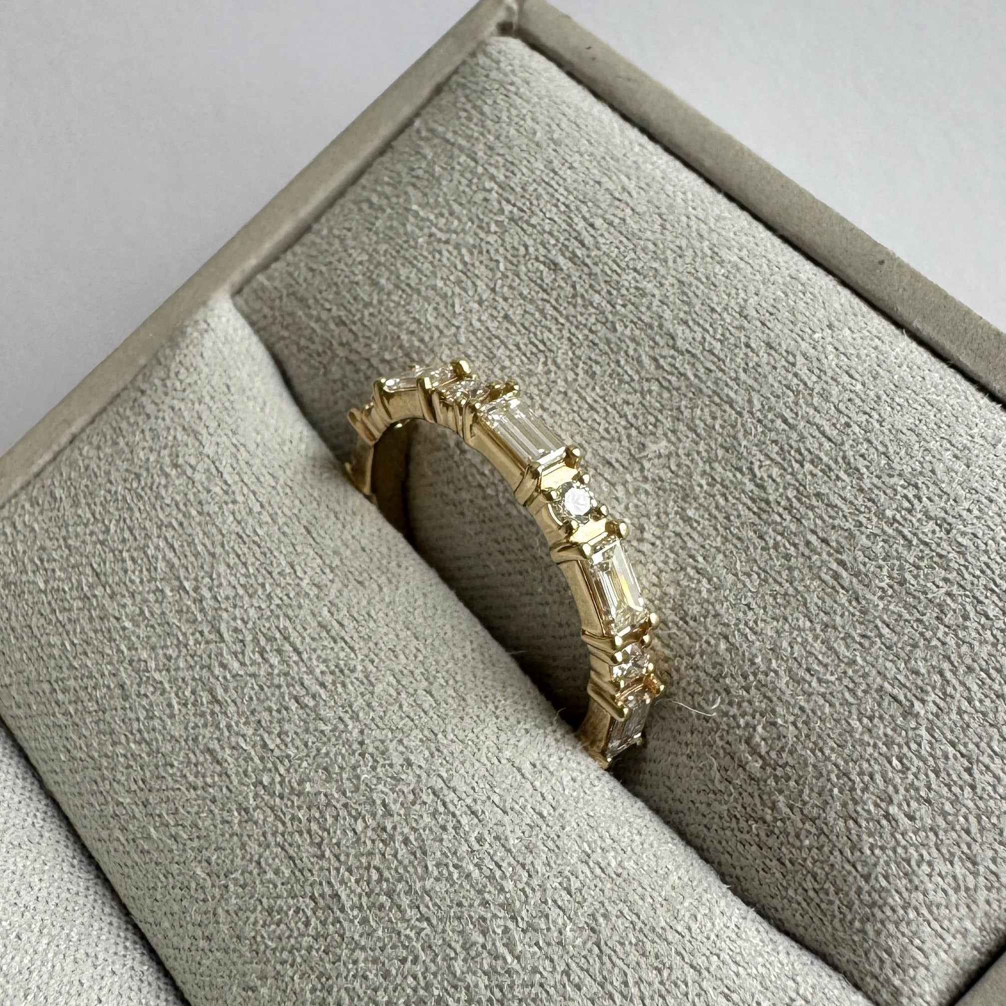 14k yellow lab grown alternating baguette and round diamond band in a size 6.  0.67 cttw.