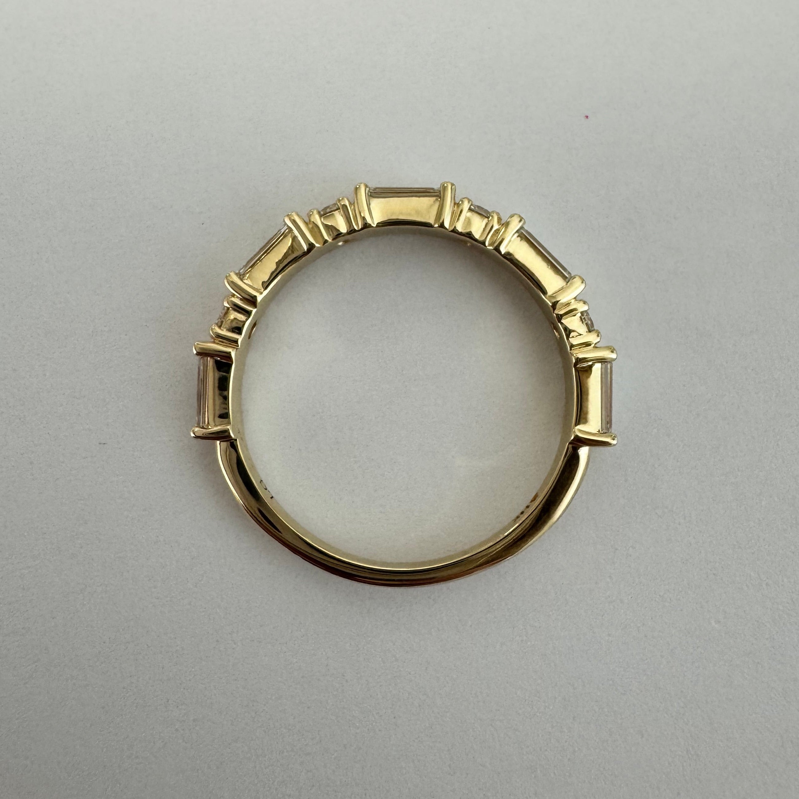 14k yellow lab grown alternating baguette and round diamond band in a size 6.  0.67 cttw.