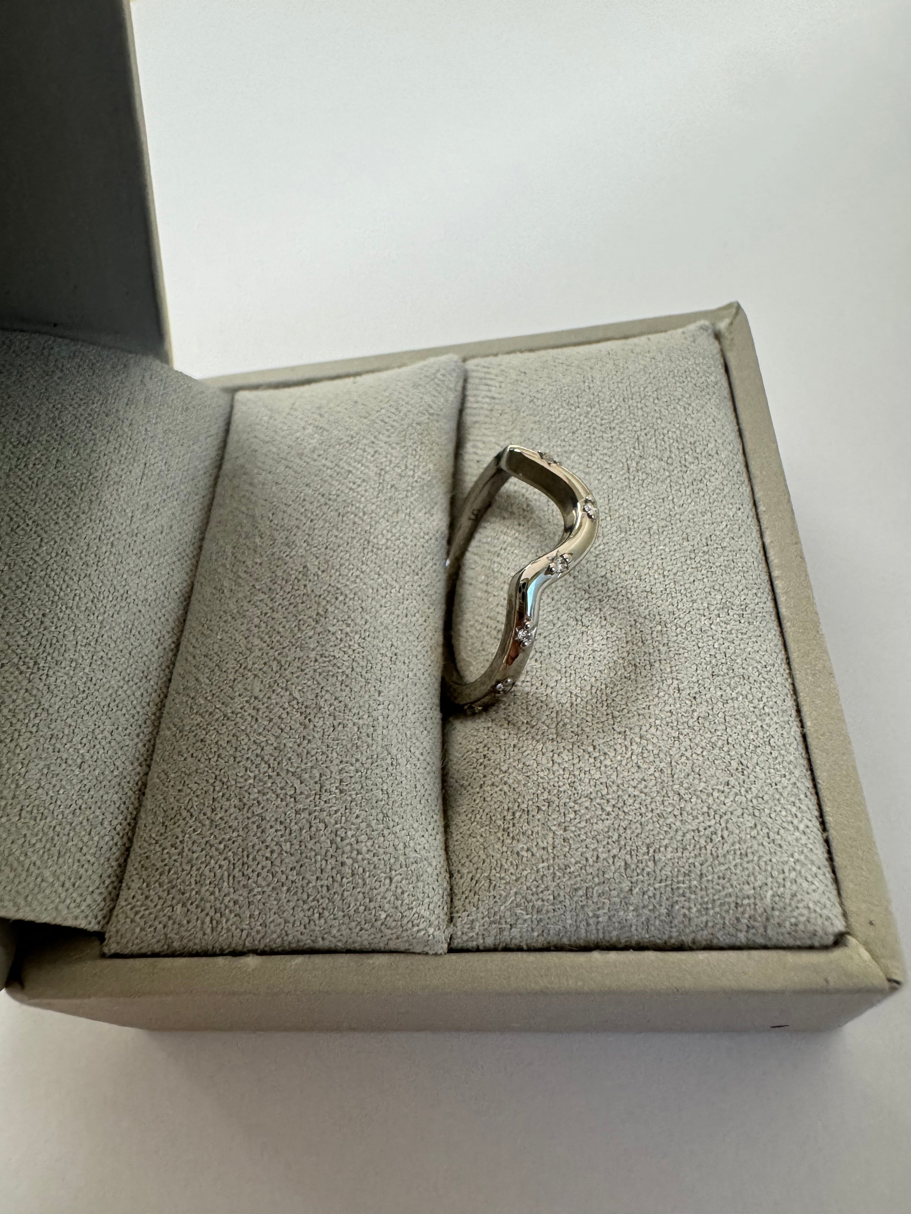 Custom 14k white gold lab grown diamond curved wedding band. Size 5.