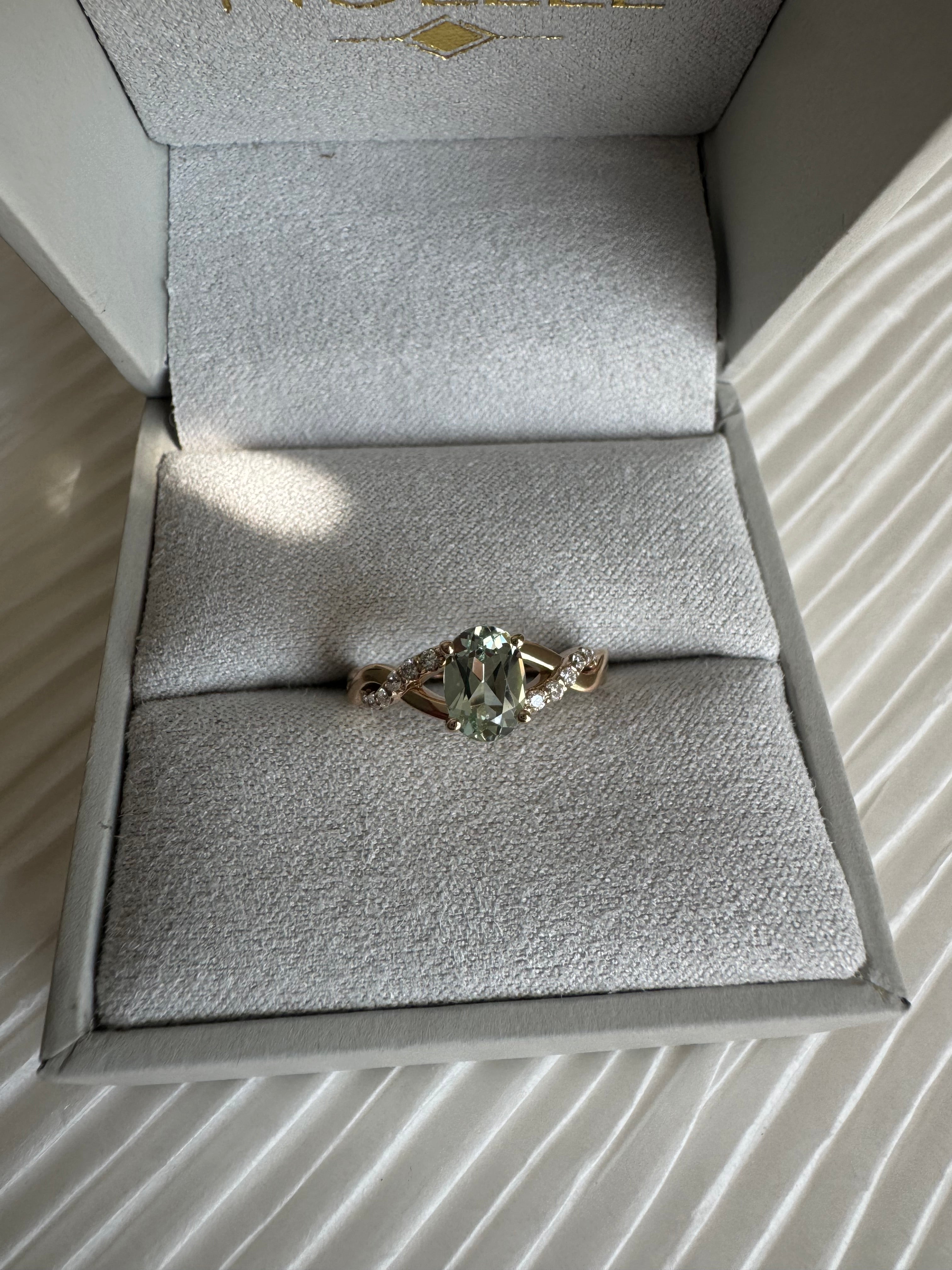 Custom 14k yellow gold lab grown oval green sapphire (1.12 cts.) and lab grown diamond (approx. 0.095cts.) engagement ring. Size 5.5