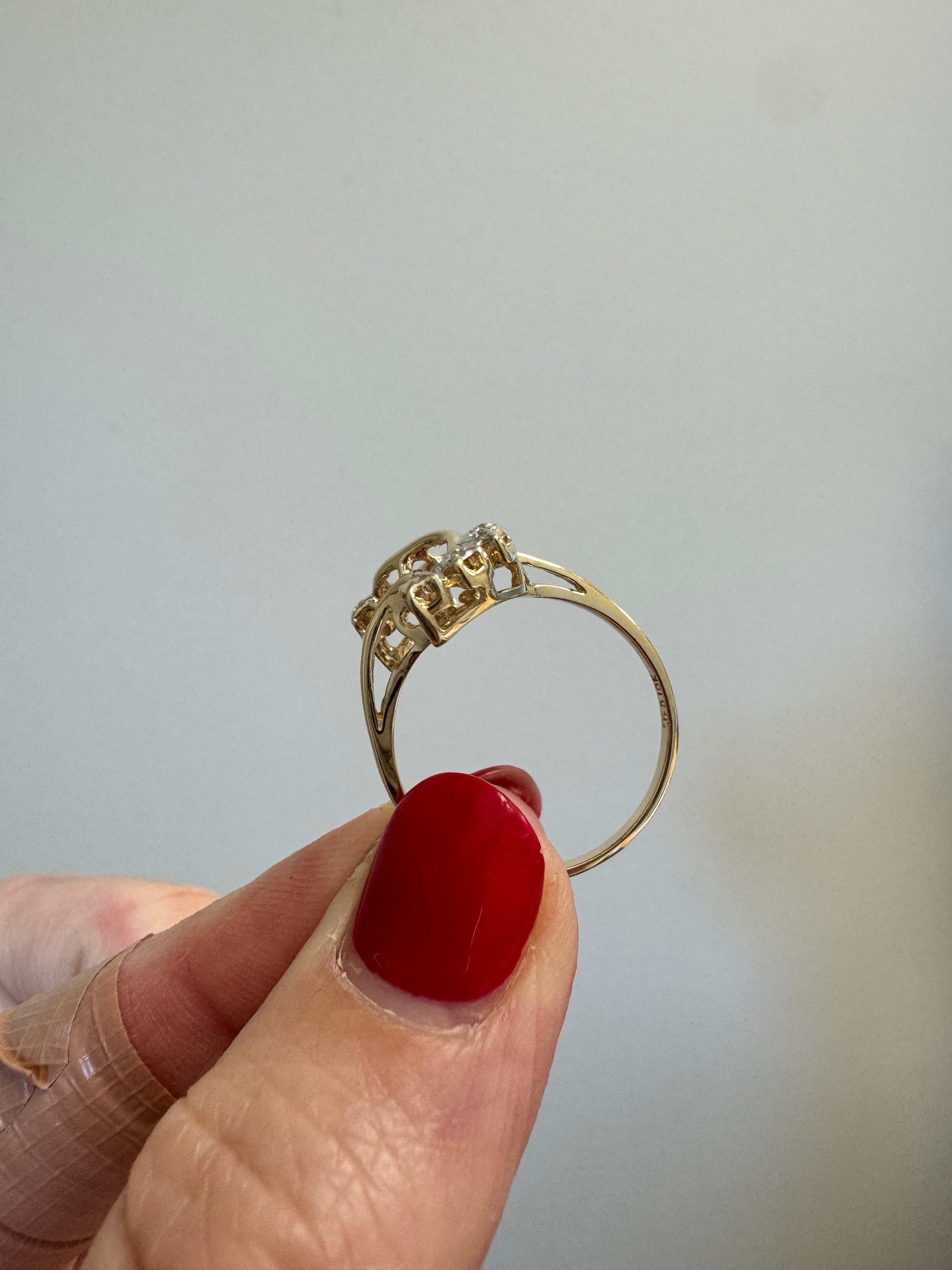 Ladies yellow gold free from, S-shaped fashion ring with 8 melee diamonds. Size up to 8.5 from 6.
