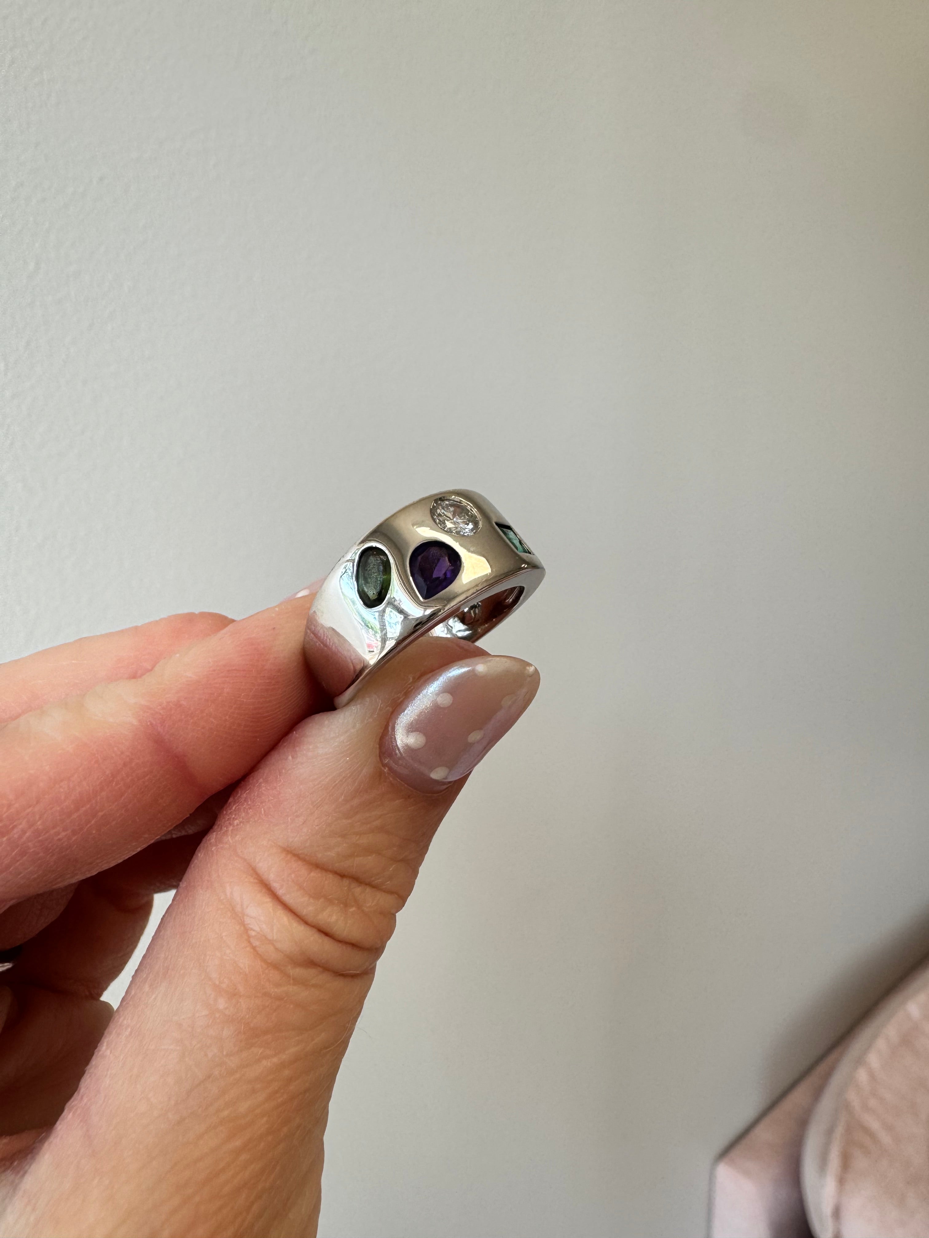 Clean, polish & rhodium: Ladies yellow gold Mother's ring with 4 flush set gemstones (round diamond, princess cut emerald, oval peridot and pear shaped amethyst)