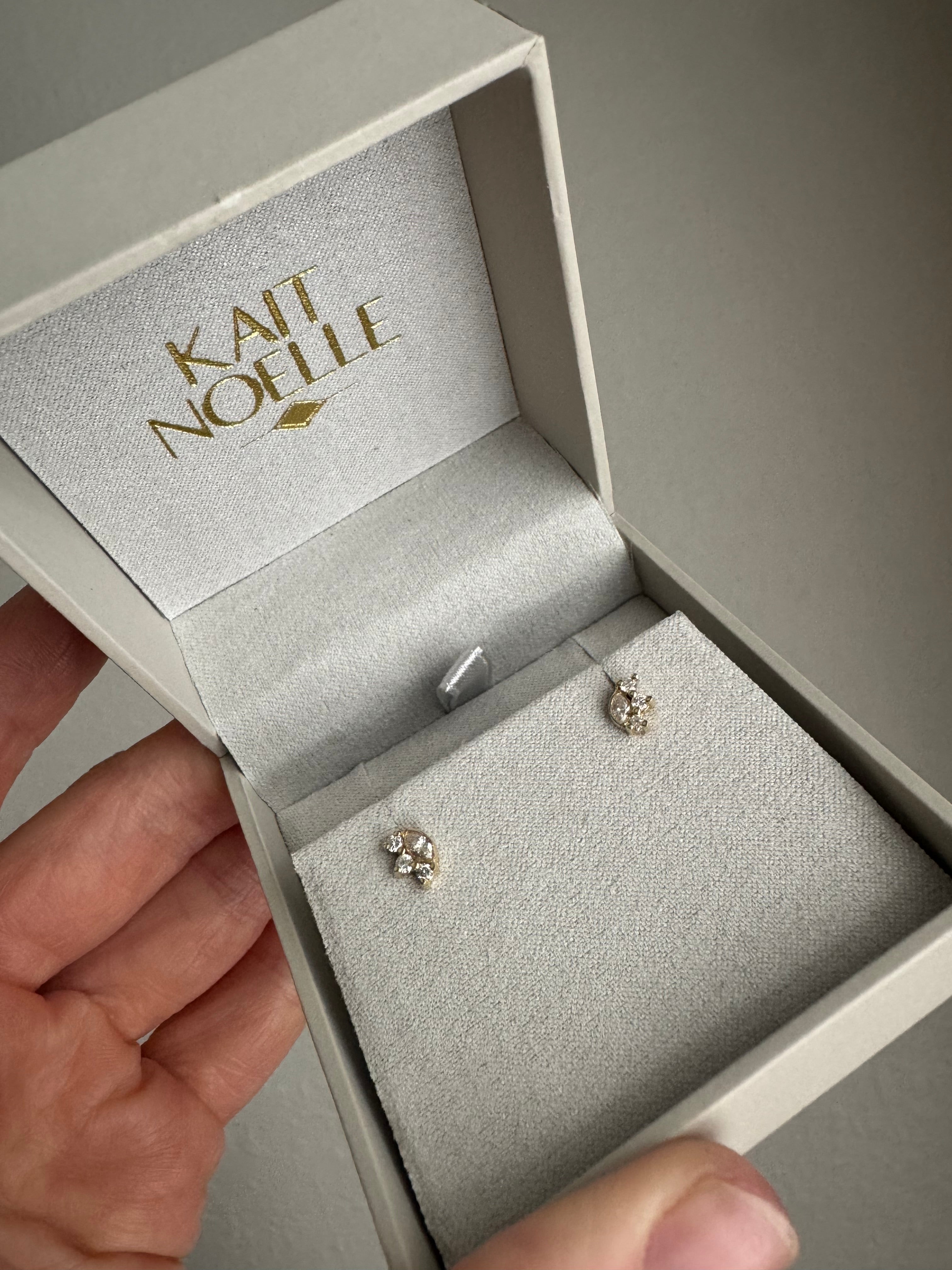 2 pairs of earrings using client's 4 marquise diamonds and 12 round diamonds (1- 14k yellow, 1- 14k white)