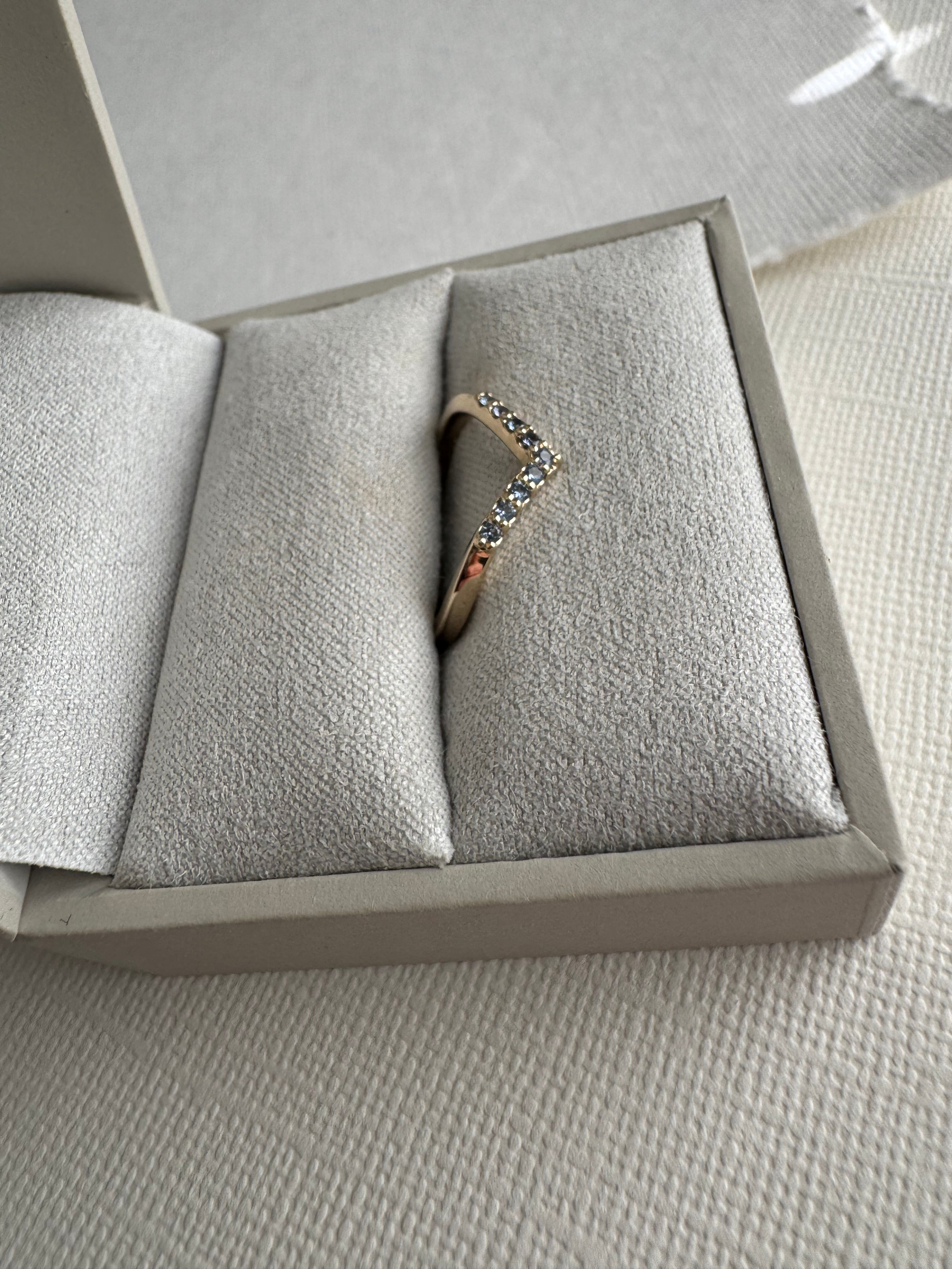 Custom 10k yellow gold Yogo Montana sapphire contoured wedding band. (10 sapphires total 0.13 carats) Size 5.