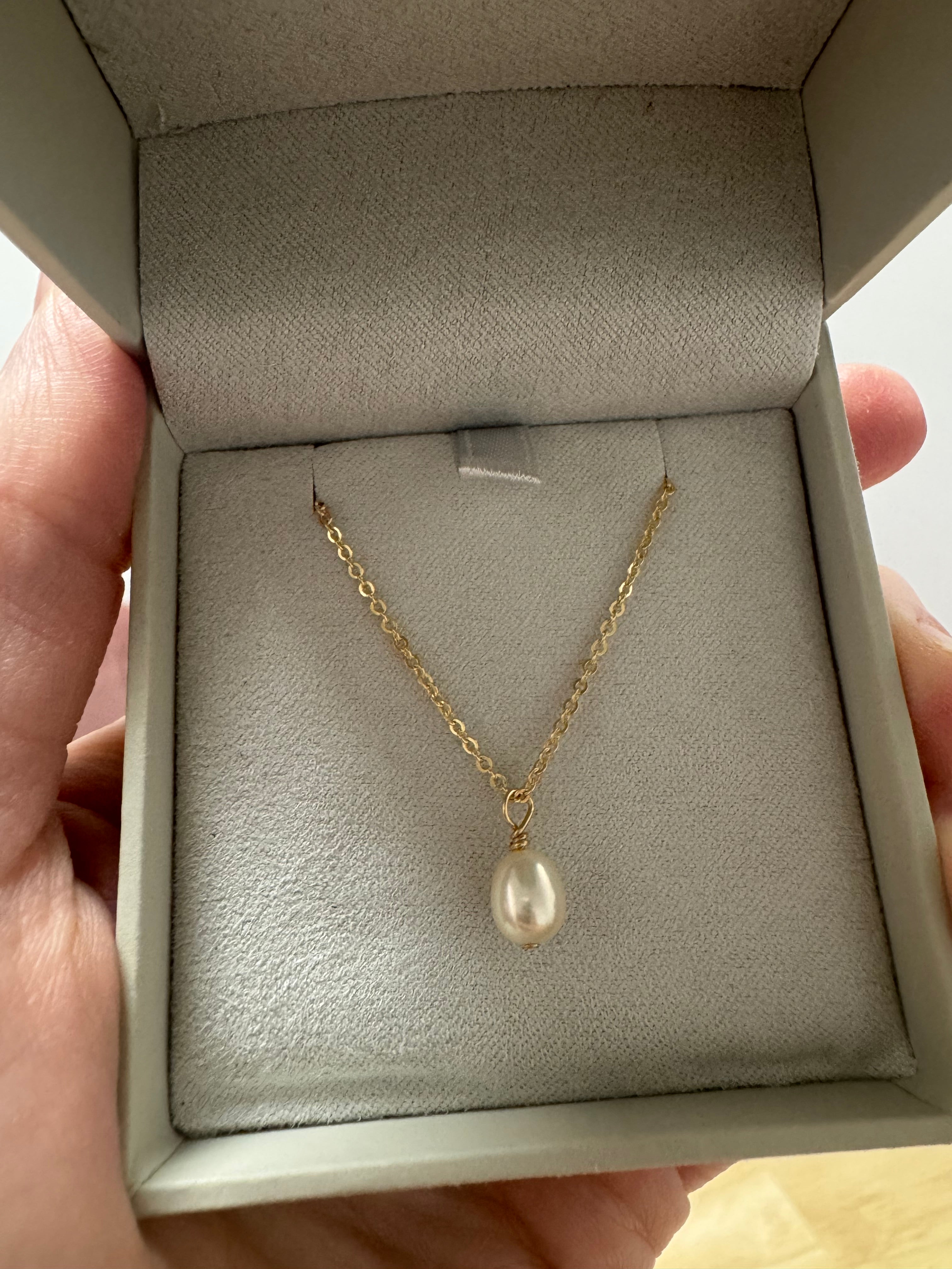 14k yellow gold filled pearl necklace (16+2"). 1, oblong 5-6mm freshwater pearl. (1.3mm flat cable chain with spring ring)