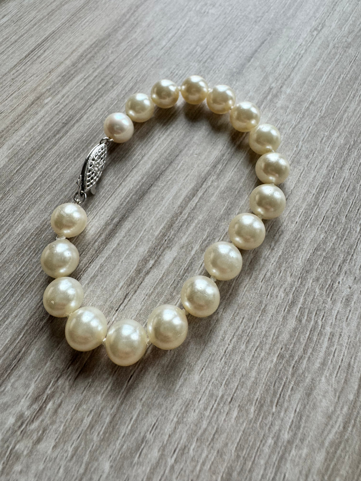 Restring pearl bracelet with 14k white gold clasp