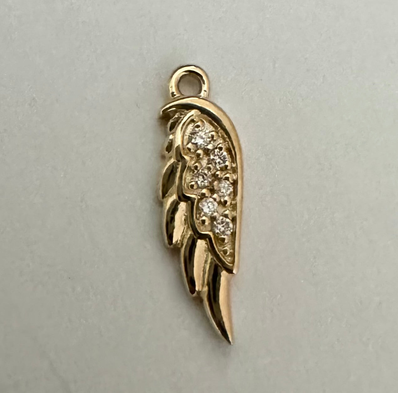 14k yellow gold diamond angel wing charm (.015 carats)