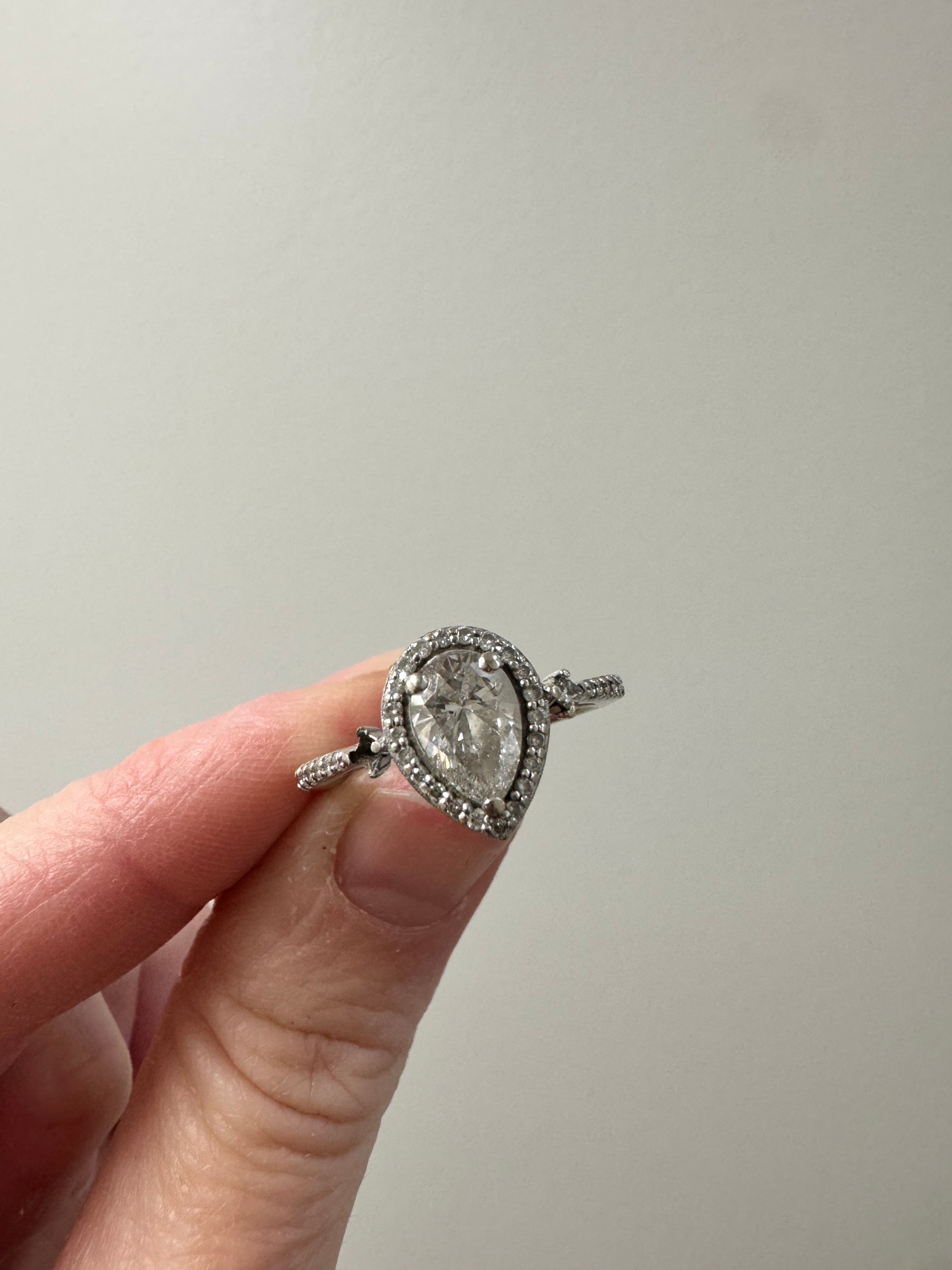 Repair eng. ring: set supplied princess cut & retip, retip other princess cut. Set supplied diamond in halo & retip. Retip 1 other missing prong in halo.