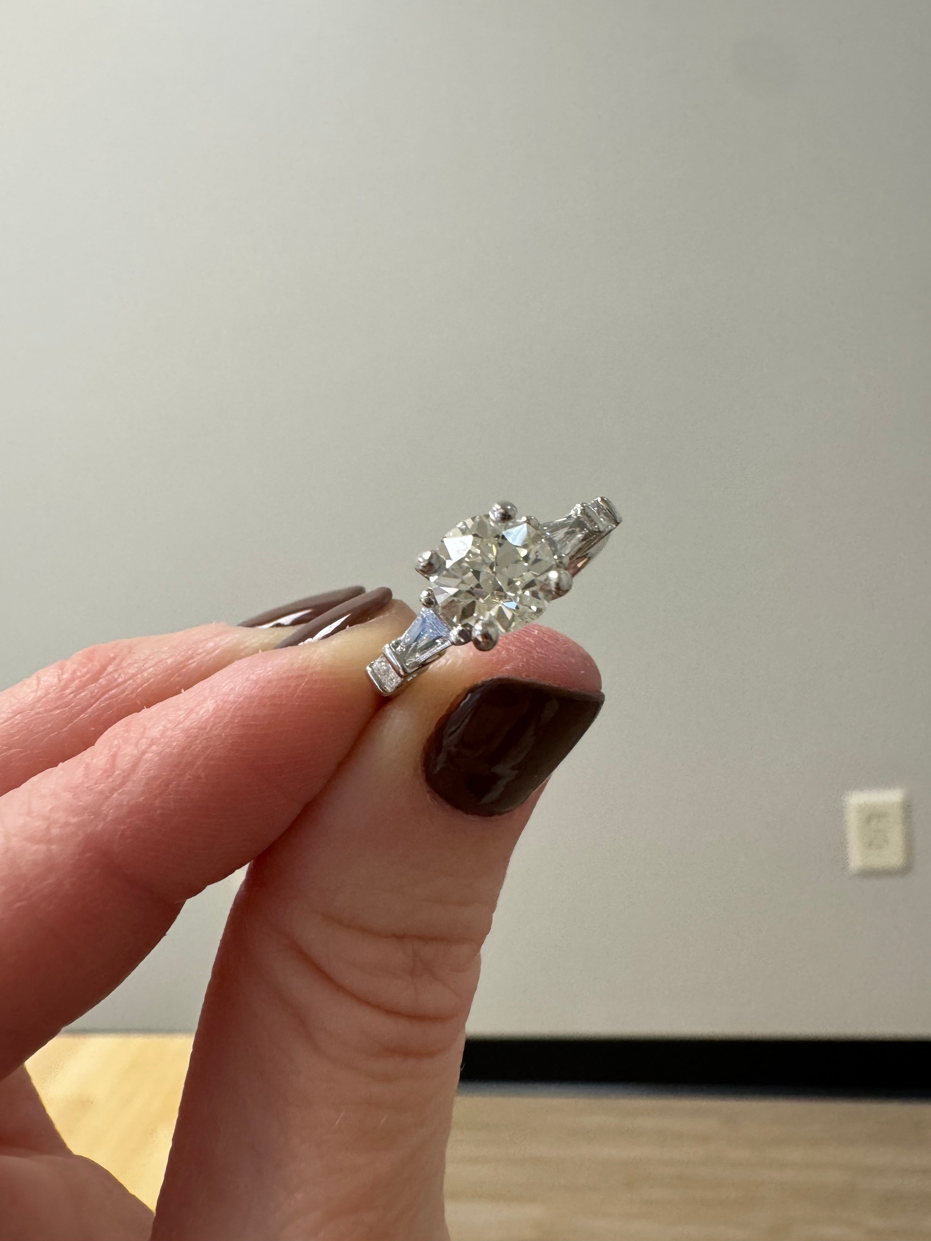 Repair: Platinum eng. ring: push down prongs that are snagging & refinish