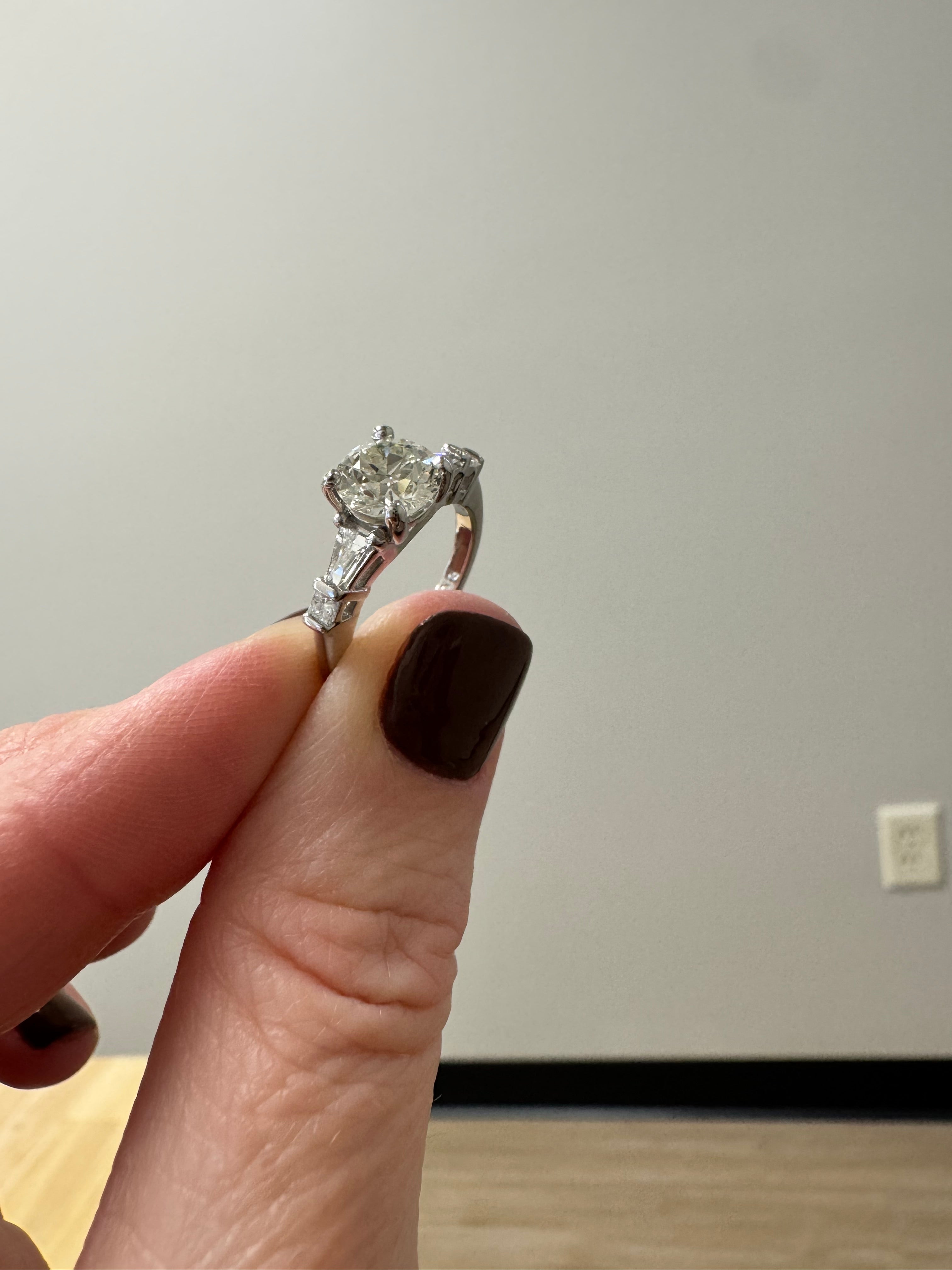 Repair: Platinum eng. ring: push down prongs that are snagging & refinish