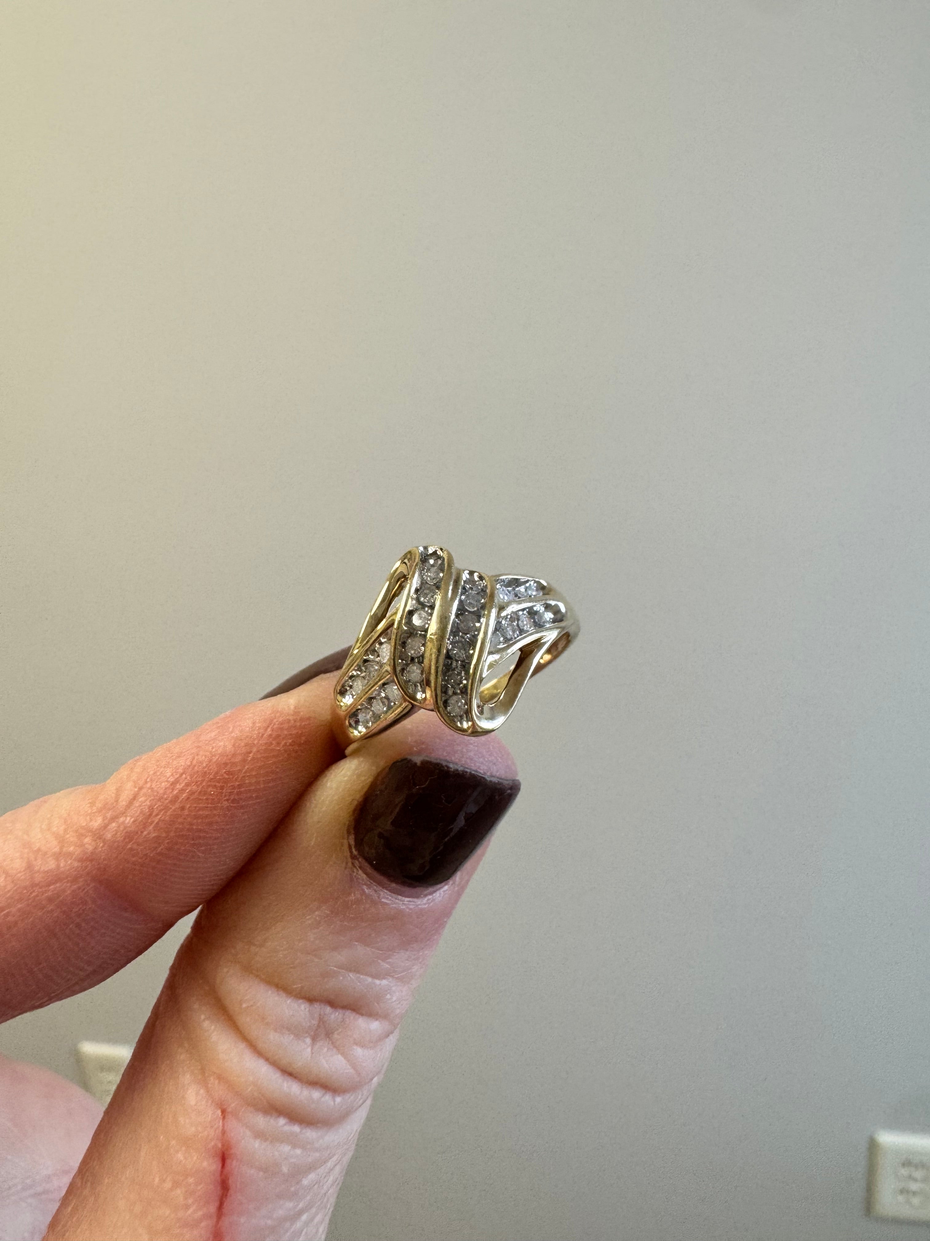 Yellow gold diamond free form ring. Size down to 8.5, reset 1 diamond and refinish.