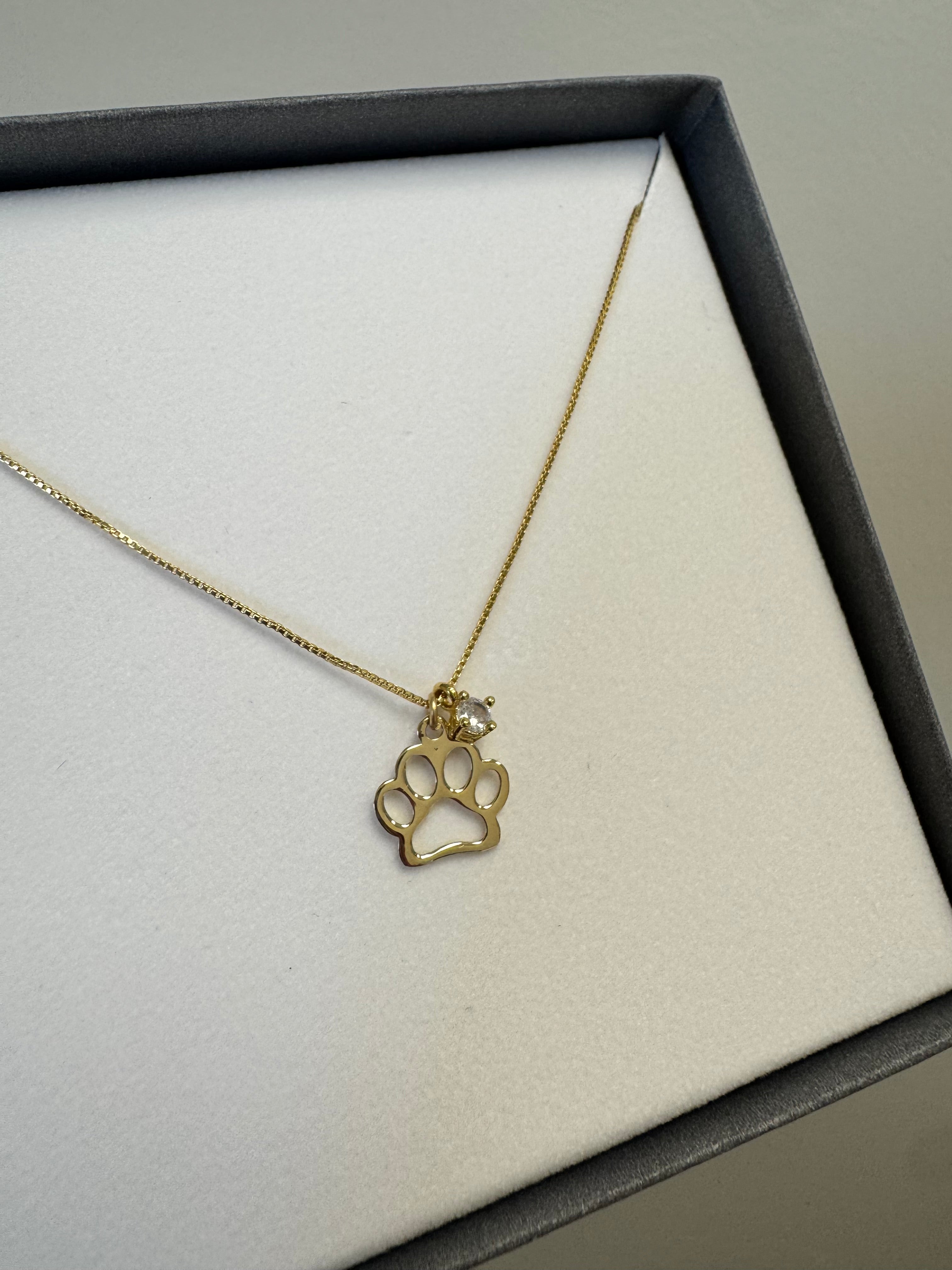 18k yellow gold filled box chain (16"+2" extender, .70mm) with 1, 3mm round CZ & 1, 14k yellow gold paw print charm.