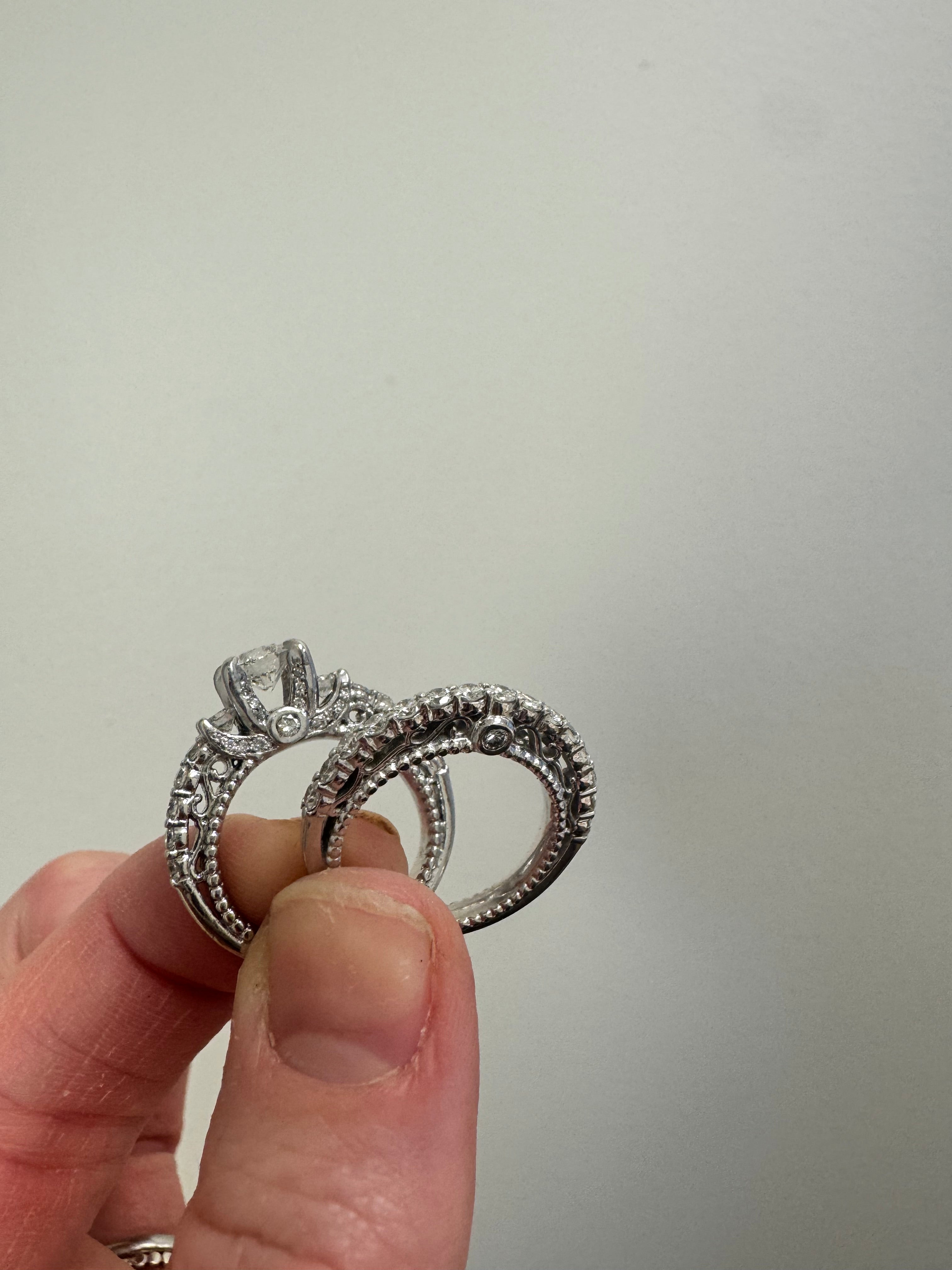 White gold vintage style wedding set: Eng ring. supply & set 2 round diamonds in center prongs & retip. Retip 1 prong on last diamond in shank. Rhodium/refinish both rings.