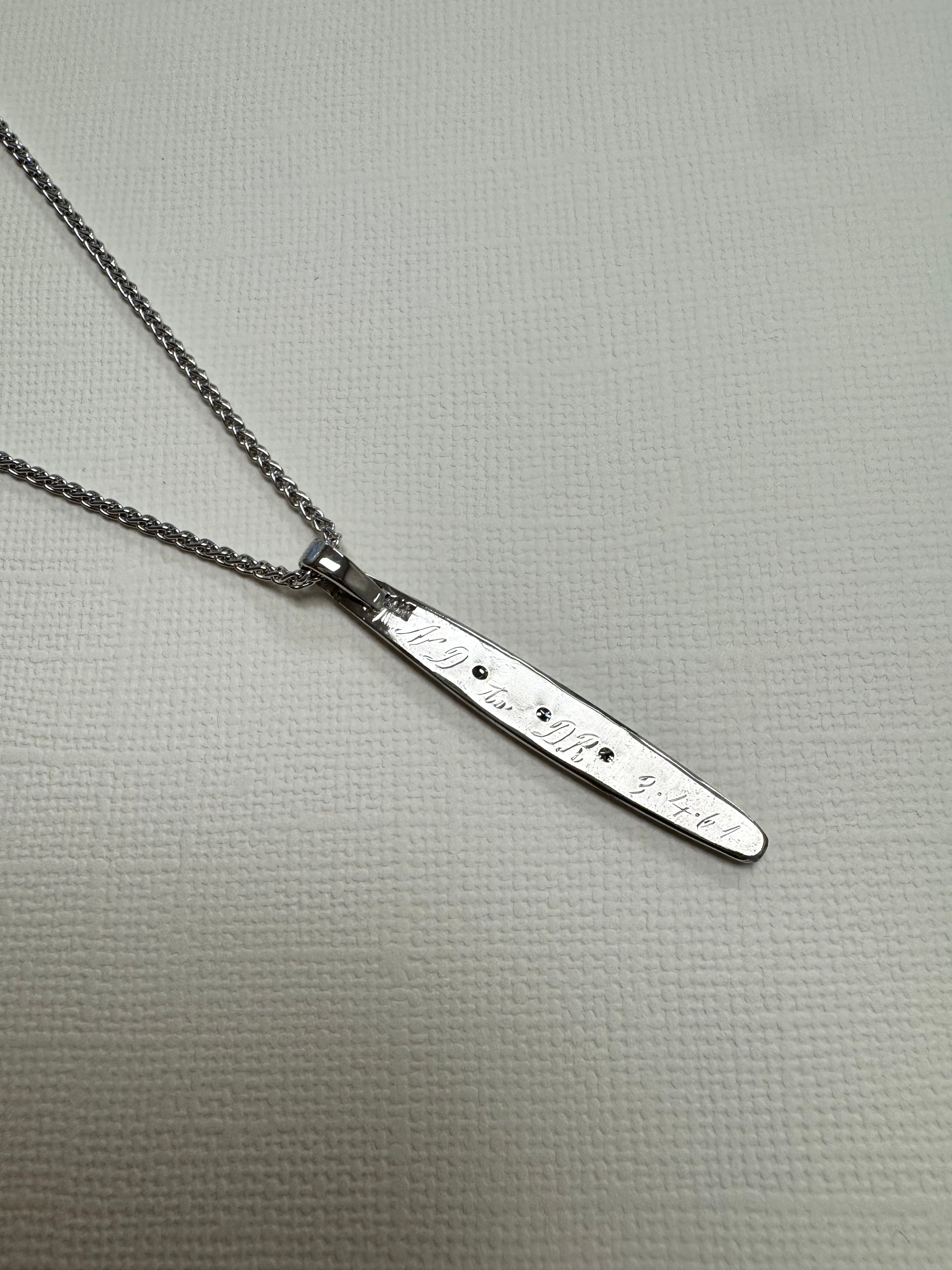 Turn white gold wedding band w/3 diamonds into pendant. Preserve engraving on back. Florentine finish on front to match original band. Supply 20", 1.6mm spiga chain in rhodiom-plated sterling silver.