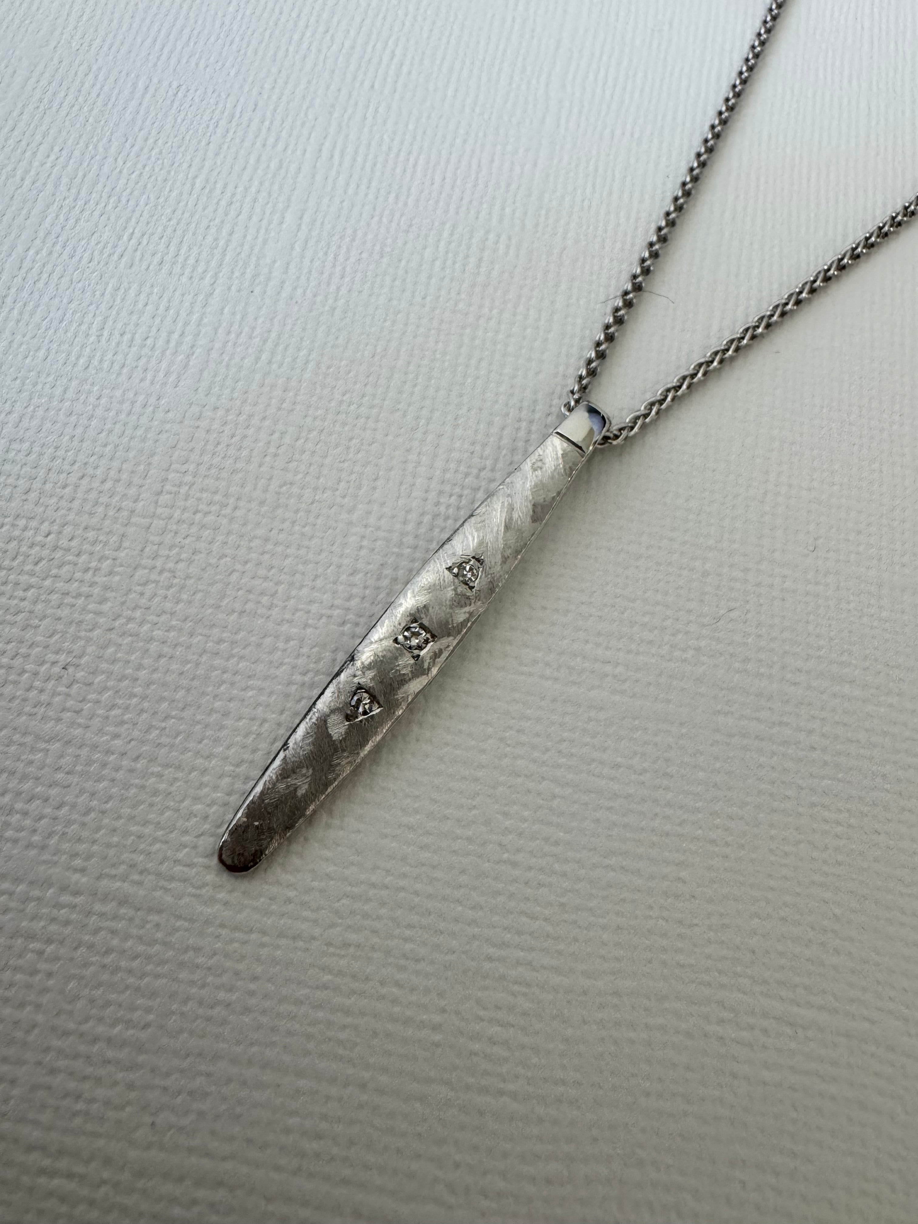 Turn white gold wedding band w/3 diamonds into pendant. Preserve engraving on back. Florentine finish on front to match original band. Supply 20", 1.6mm spiga chain in rhodiom-plated sterling silver.