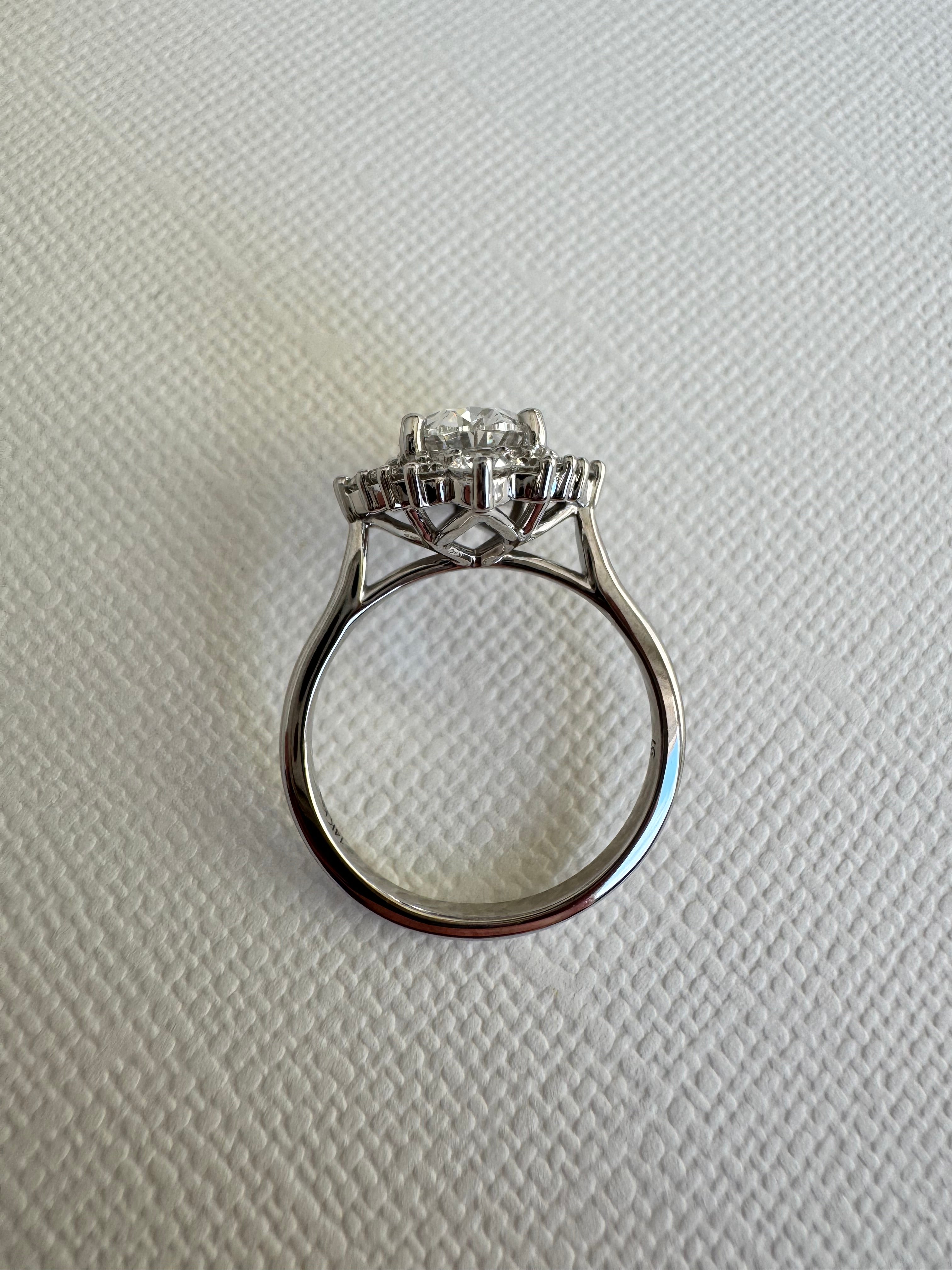 Custom 14k white gold lab grown diamond oval halo engagement ring. Size 7.25. Center= 2.01 ct lab grown oval diamond (E color, VS1 clarity). IGI certified.